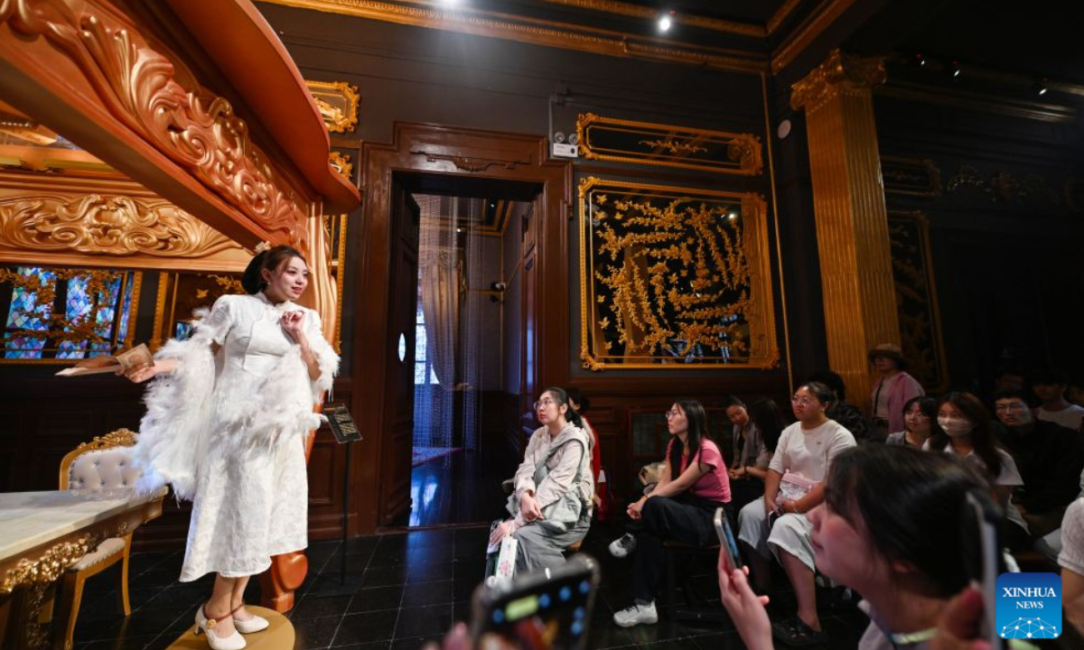 Tourists view a live-action exhibition at the former site of L'indo Bank of China in Tianjin, north China, Sept. 27, 2026. Built in 1912, the former site of L'indo Bank of China is one of the landmarks in Tianjin's Jiefang North Road historical and cultural block, witnessing the development of the city's financial industry in modern times.
This building had undergone many historical changes and had been used successively as an art museum, an international auction house, and a museum of Western art. However, due to the scarcity of exhibitions, it had been idle for a long time until the latest renovation.
In 2025, Beijing Performance & Arts Group, together with Tianjin North Performing Arts Group, initiated the revitalization of the building, creating an immersive performance scene while preserving its original appearance.
This April, the newly renovated building was officially opened to the public, and visitors can view a live-action exhibition here during the day and watch an immersive drama at night.
Up to now, the renovated building has received approximately 30,000 visitors. (Xinhua/Zhao Zishuo)