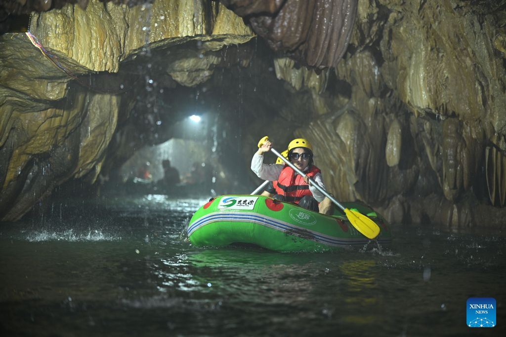 Tourists enjoy rafting at a scenic area in Huangping County, southwest China's Guizhou Province, July 29, 2026. During the summer vacation, Huangping has leveraged its mountain springs and canyon landscapes to develop a rafting tourism brand, attracting visitors for a refreshing getaway while boosting local tourism and incomes. (Photo by Zhang Ping/Xinhua)