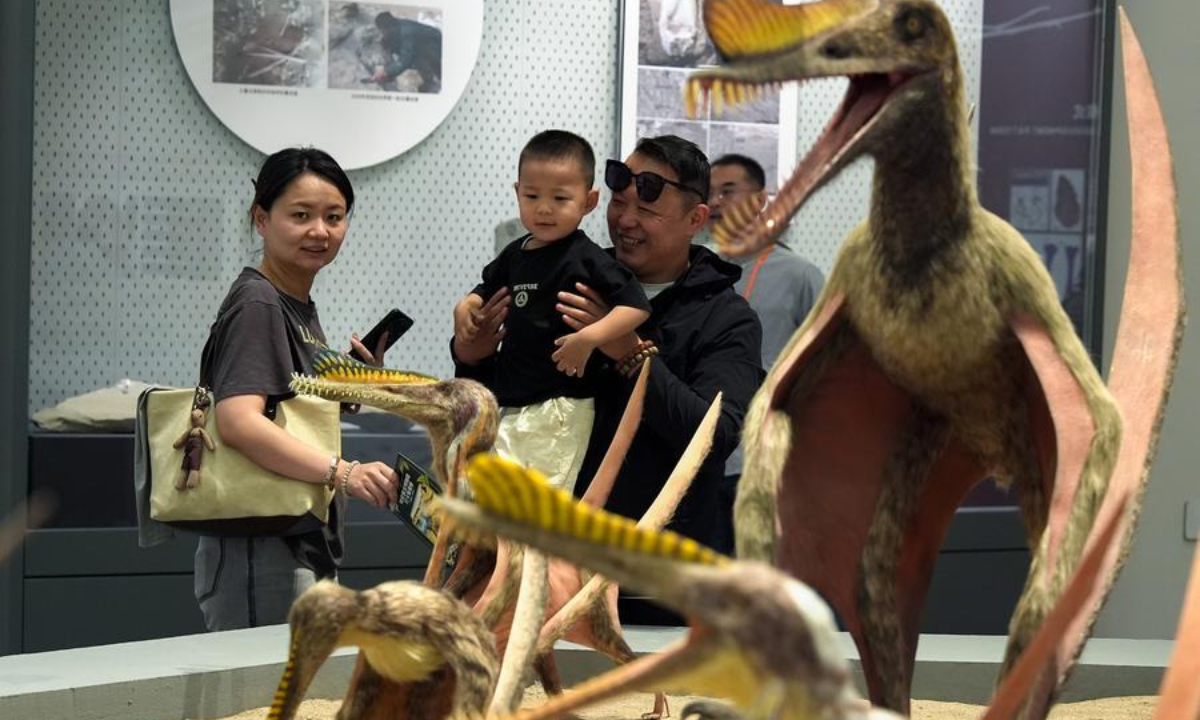 Visitors view pterosaurs replicas at a science museum in Hami, northwest China's Xinjiang Uygur Autonomous Region, Sept. 13, 2026. (Photo by Polat Niyaz/Xinhua)