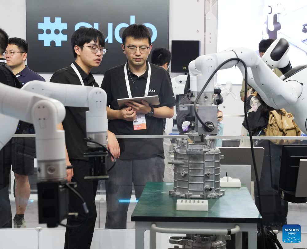 Staff members work at the Shanghai World Expo Exhibition and Convention Center in Shanghai, east China, July 16, 2026. Shanghai is ushering in its major AI moment of the year with the forthcoming 2026 World AI Conference (WAIC) and High-Level Meeting on Global AI Governance, scheduled from Friday to Monday. Themed