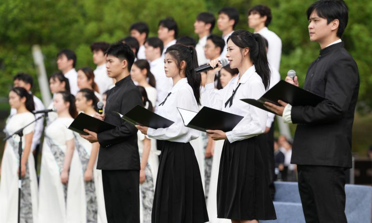 College students recite poems during a ceremony marking the 81st anniversary of the victory of the Chinese People's War of Resistance against Japanese Aggression and the World Anti-Fascist War at the Memorial Hall of the Victims in Nanjing Massacre by Japanese Invaders, in Nanjing, east China's Jiangsu Province, Sept. 3, 2026. (Xinhua/Li Bo)