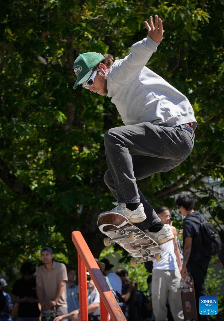 A skateboarder performs a trick during a Go Skateboarding Day event in Vancouver, British Columbia, Canada, on June 21, 2026. (Photo by Liang Sen/Xinhua)
