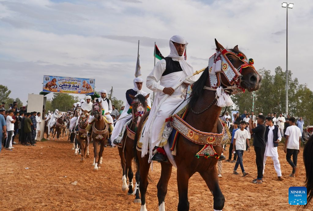 Riders take part in a traditional equestrian festival in Souq al-Khamis Amsihel, Libya, Oct. 7, 2026. (Photo by Hazem Turkia/Xinhua)