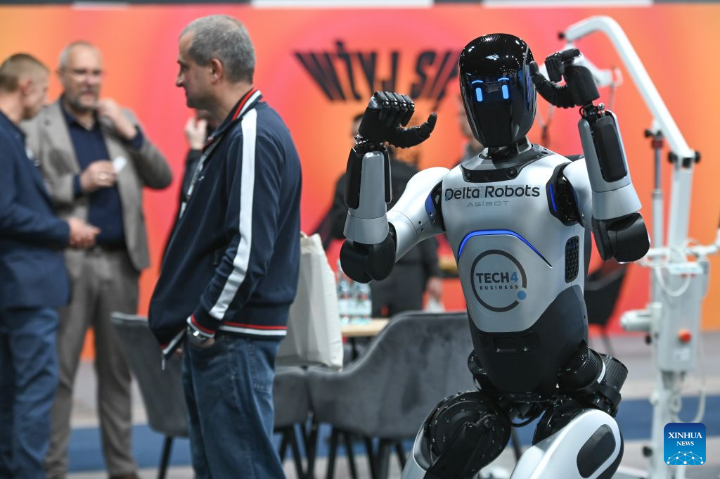 A humanoid robot performs a demonstration at the World of AI and Big Data Expo in Warsaw, Poland, Sept. 22, 2026. Held from Sept. 22 to 24, the World of AI and Big Data Expo in Warsaw focuses on artificial intelligence, big data and related digital technologies, showcasing innovations in AI applications, data management, robotics and intelligent automation. (Photo by Aleksy Witwicki/Xinhua)