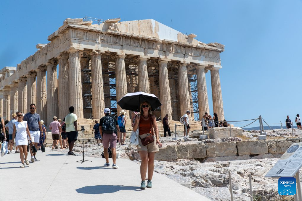People visit the Acropolis during a heatwave in Athens, Greece, Aug. 25, 2026. (Xinhua/Marios Lolos)