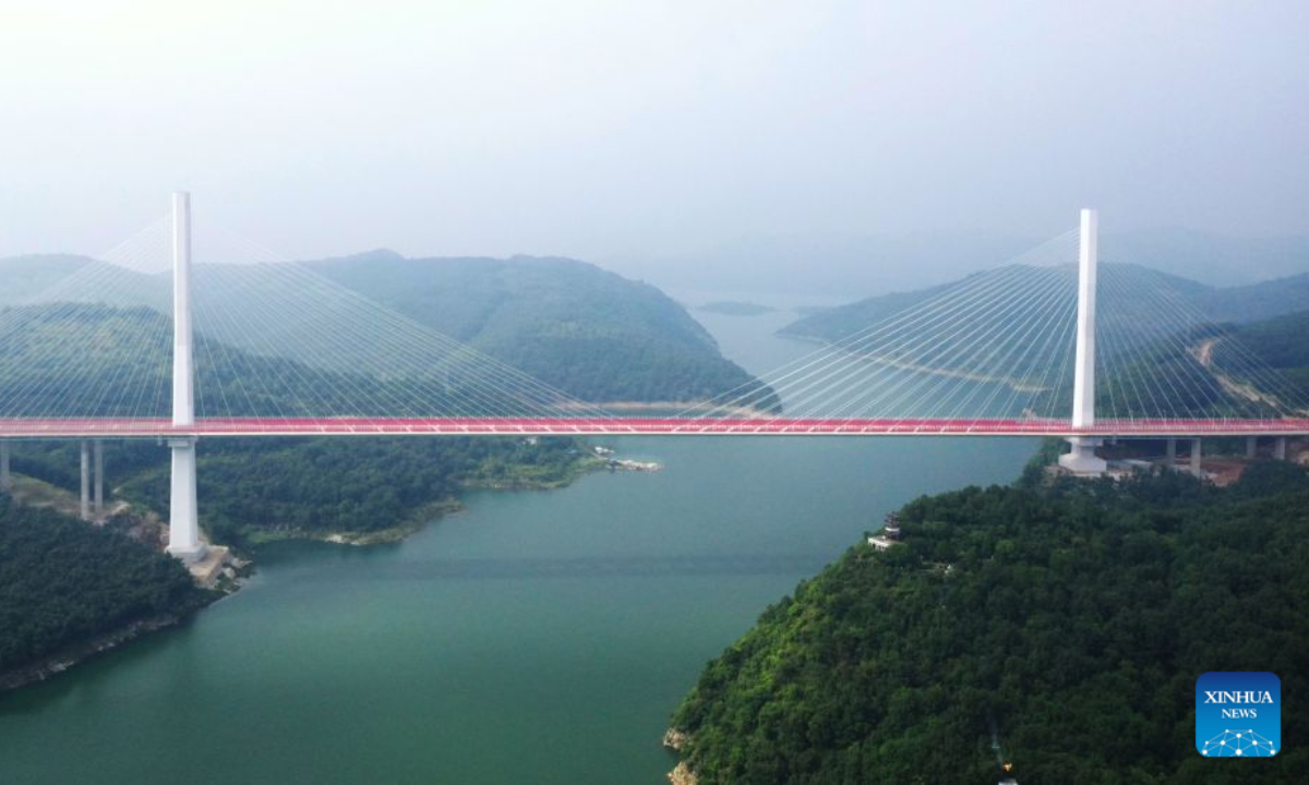 An aerial drone photo taken on Aug. 20, 2026 shows a view of a grand bridge at the Danjiangkou Reservoir in Nanyang, central China's Henan Province. (Photo by Kong Weijia/Xinhua)