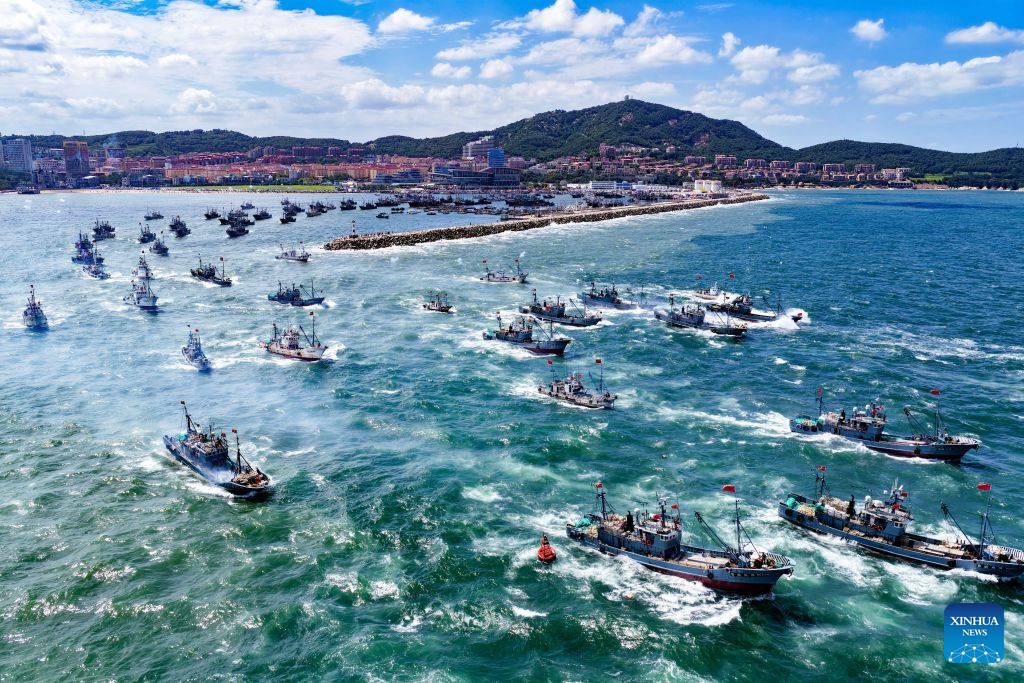 An aerial drone photo taken on Sept. 1, 2026 shows fishing boats heading toward fishing grounds in Weihai, east China's Shandong Province. The new fishing season in the Yellow Sea and Bohai Sea kicked off on Tuesday after a four-month summer fishing moratorium. (Photo by Zhu Chunxiao/Xinhua)