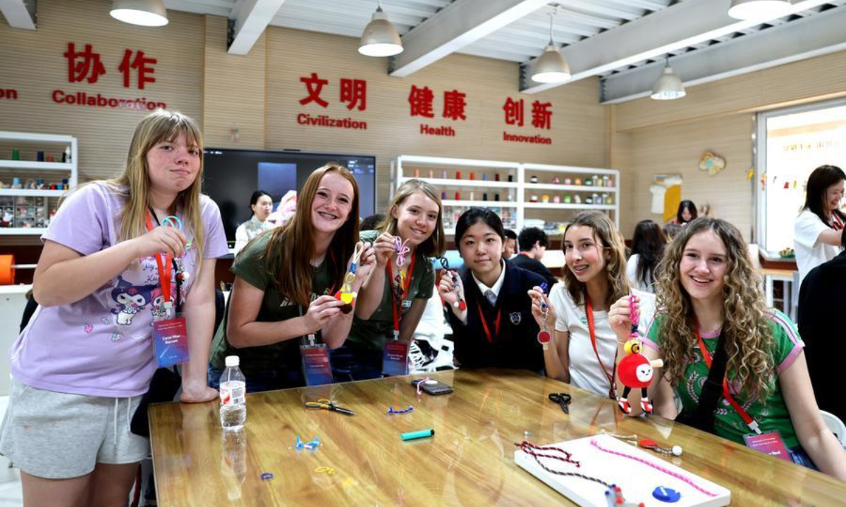 Students from the United States show their handicrafts at a school in Shijiazhuang, north China's Hebei Province, April 11, 2026. (Xinhua/Lu Ye)