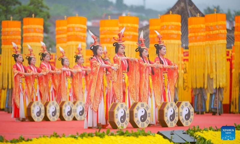 Participants stage a music-and-dance ritual during a ceremony worshiping Fuxi, a mythical ancestor of the Chinese nation, in Tianshui, northwest China's Gansu Province, June 21, 2026. Tianshui is known as the birthplace of the mythical figure, who is worshiped for his contribution to teaching people about fishing, hunting and animal husbandry. According to historical records, the annual commemoration of Fuxi has a history of more than 2,000 years. It was listed as a form of national intangible cultural heritage in 2006. (Photo by Liu Keying/Xinhua)