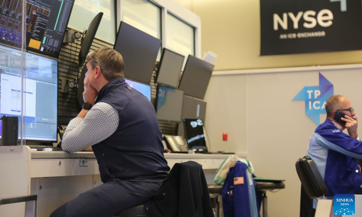 Traders work on the trading floor of the New York Stock Exchange in New York City, the United States, Oct. 7, 2026. U.S. stocks closed lower on Wednesday as benchmark Treasury yields touched multi-year highs. (Xinhua/Liu Yanan)