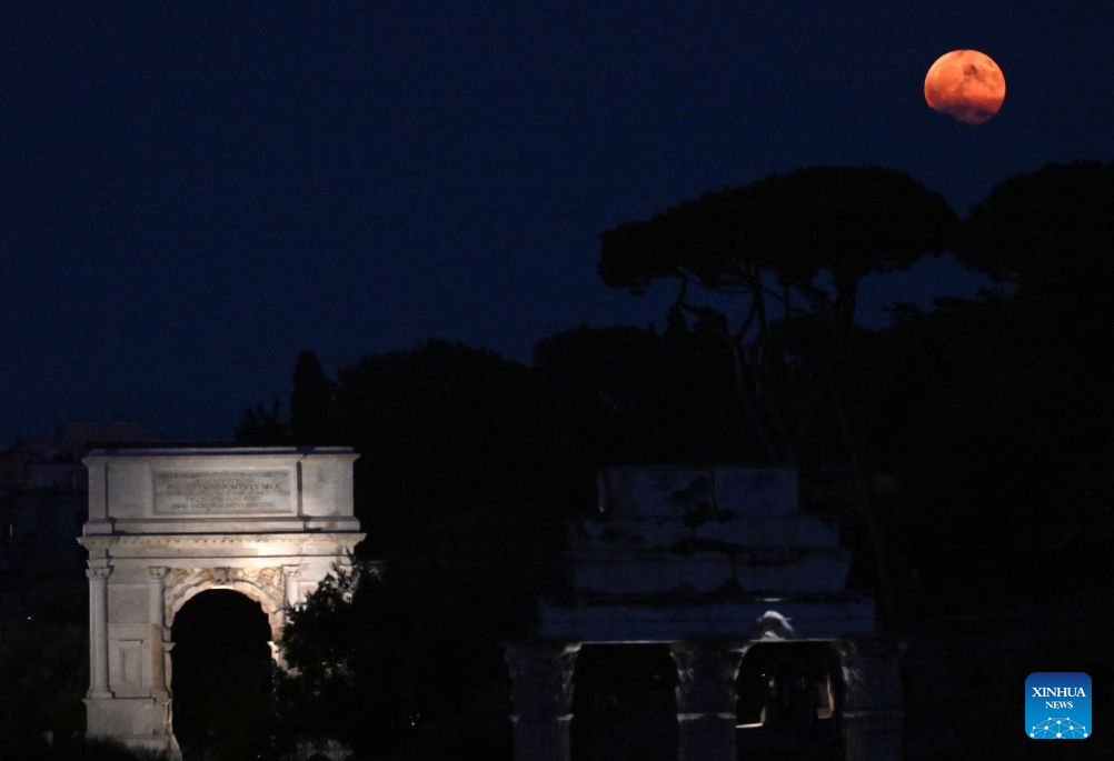 A full moon is seen from the Imperial Forum in Rome, Italy, July 29, 2026. (Photo by Alberto Lingria/Xinhua)