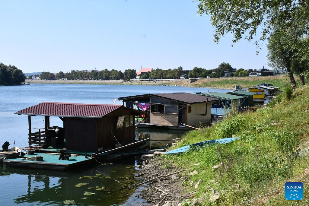 This photo taken on Aug. 4, 2026 shows Splavarska Street in Slavonski Brod, Croatia. Splavarska Street is unique in the country as its residents live on the water of Sava River, in houseboats with their own official addresses and house numbers. (Ivica Galovic/PIXSELL via Xinhua)