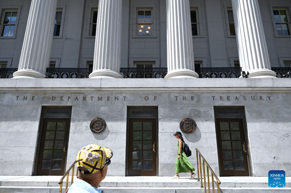 People walk past the U.S. Department of the Treasury in Washington, D.C., the United States, Aug. 24, 2026. U.S. Treasury Secretary Scott Bessent on Monday threatened Iran with an economic D-Day, announcing a wave of new sanctions aimed at further isolating the country. (Xinhua/Li Rui)