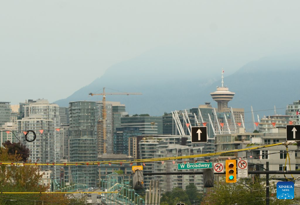 This photo taken on Aug. 4, 2026 shows a view of downtown Vancouver under smoky sky in Vancouver, British Columbia, Canada. Amid extreme heatwaves and record-breaking drought, wildfires have broken out in many parts of Canada, reducing air quality and visibility in the affected areas. (Photo by Liang Sen/Xinhua)