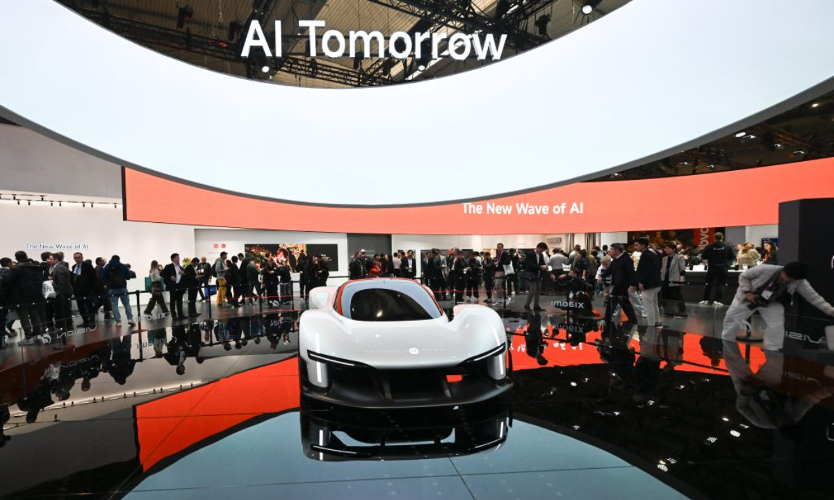 People view a vehicle displayed at the booth of Xiaomi during the 2026 Mobile World Congress (MWC) in Barcelona, Spain, March 2, 2026.  (Xinhua/Cheng Min)