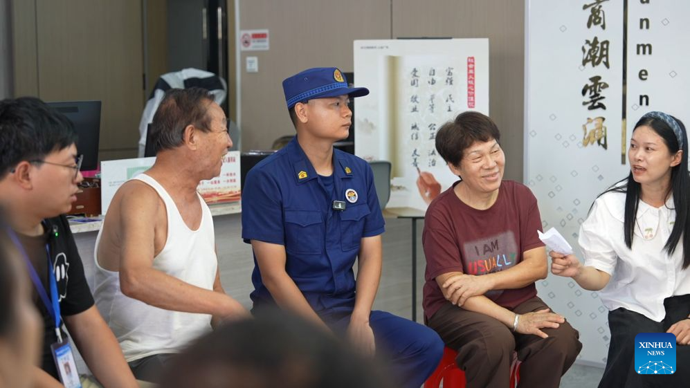 Residents and officials attend a roundtable discussion at a community in Xihu District of Nanchang, east China's Jiangxi Province, July 16, 2026.
As a form of grassroots community governance, roundtable discussions are widely organized in residential communities across the city to address residents' concerns, resolve neighborhood disputes, and tackle community issues. (Xinhua/Chen Yushan)