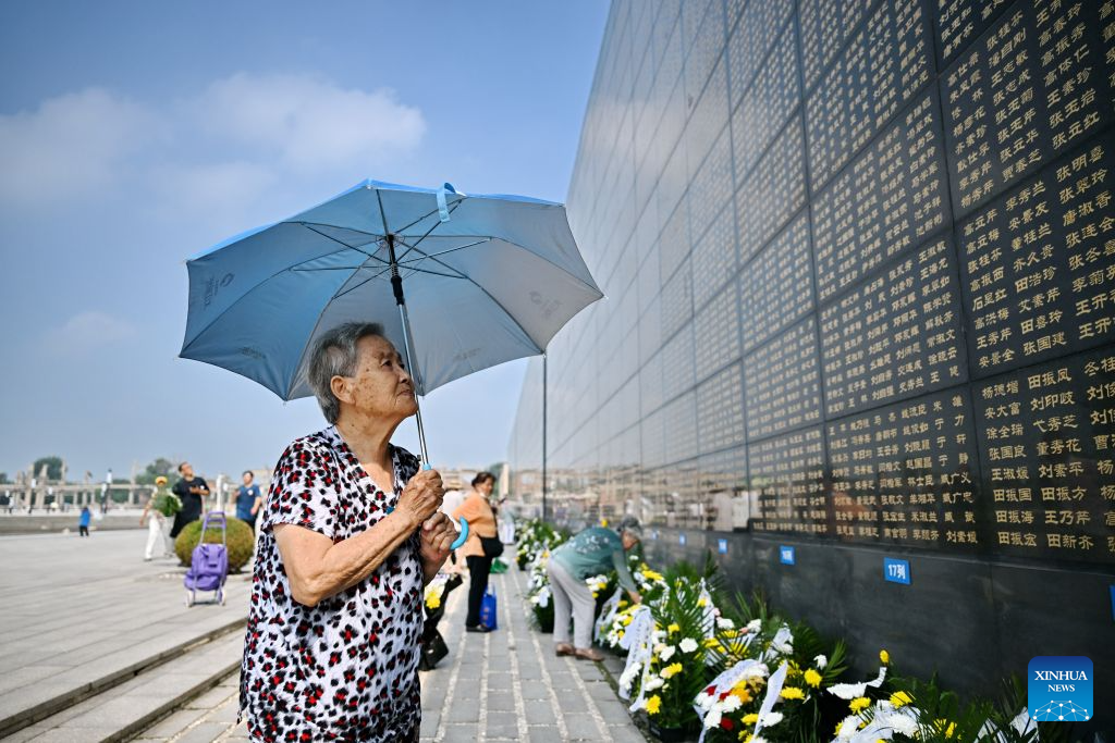 A citizen mourns in front of a memorial wall inscribed with names of the victims at the Tangshan Earthquake Memorial Park in Tangshan, north China's Hebei Province, July 28, 2026. This year marks the 50th anniversary of the Tangshan Earthquake, a magnitude-7.8 quake that struck the city on July 28, 1976, taking the lives of more than 240,000 people and destroying virtually all buildings in the city.

Crowds of people visited the Tangshan Earthquake Memorial Park on Tuesday to mourn and remember the victims in the devastating disaster. (Xinhua/Mu Yu)