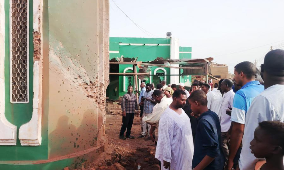 This photo taken with a mobile phone shows residents inspecting a drone-attacked mosque in Al-Droshab, north of Sudan's capital Khartoum on Aug. 12, 2026. (Photo by Mohamed Khidir/Xinhua)
