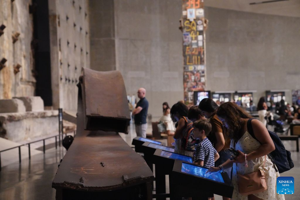 People view an exhibit at the National September 11 Memorial & Museum in New York, the United States, on Aug. 31, 2026. A preview of an exhibition marking the 25th anniversary of the 9/11 attacks was held here on Monday. (Xinhua/Zhang Fengguo)