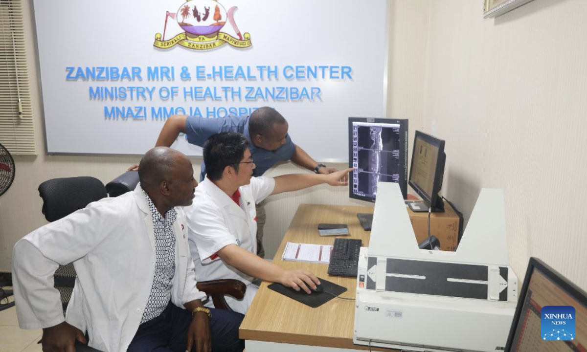 This photo taken on May 28, 2026 shows Yuan Gang, a radiologist with the 35th Chinese medical team in Zanzibar, discussing MRI images with local doctors at Mnazi Mmoja Hospital in Zanzibar, Tanzania. (The 35th Chinese medical team in Zanzibar/Handout via Xinhua)