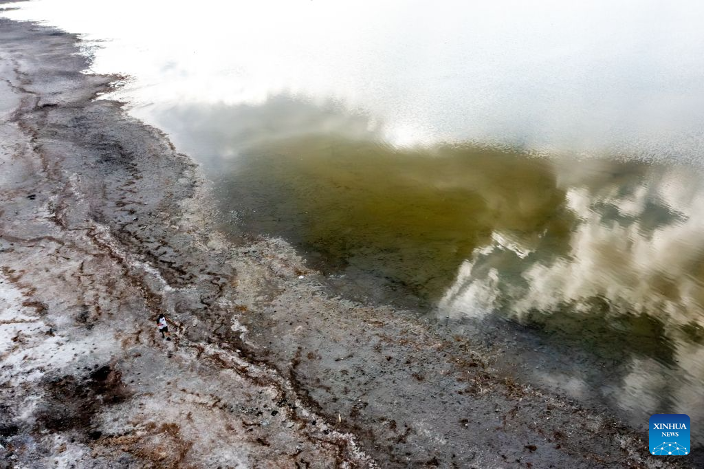 An aerial drone photo taken on Aug. 26, 2026 shows a view of the drought-stricken Lake Velence near Gardony, Hungary. Prolonged drought has pushed Lake Velence, one of Hungary's major lakes, to its lowest level on record. By Aug. 26, the water level had fallen to 16 centimeters, exposing the lakebed along several shallow stretches. (Photo by David Balogh/Xinhua)