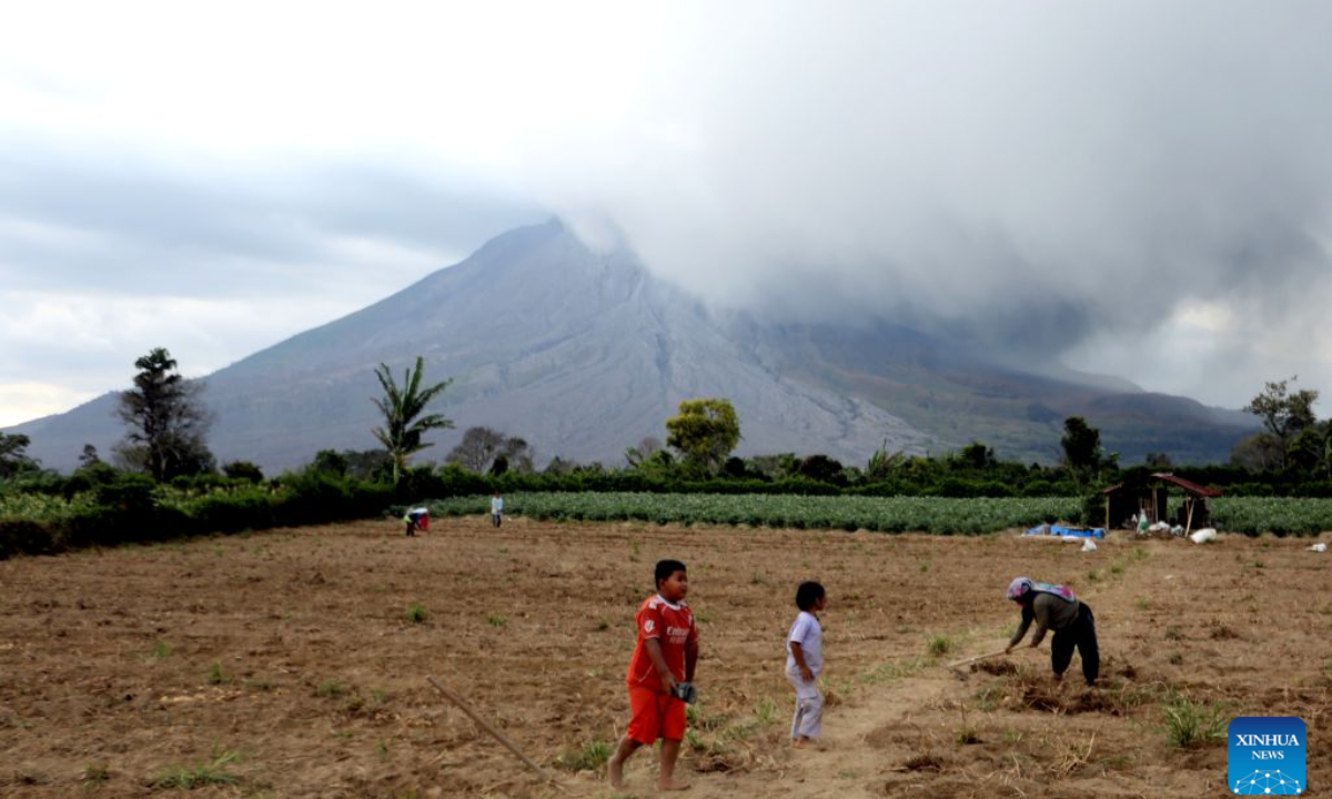 Volcanic materials are seen spewing from Mount Sinabung in North Sumatra Province, Indonesia, Aug. 31, 2026. Mount Sinabung in Indonesia's North Sumatra province erupted Monday morning, sending volcanic ash over the nearby city of Berastagi, a local monitoring official said. (Photo by Adiva Niki/Xinhua)