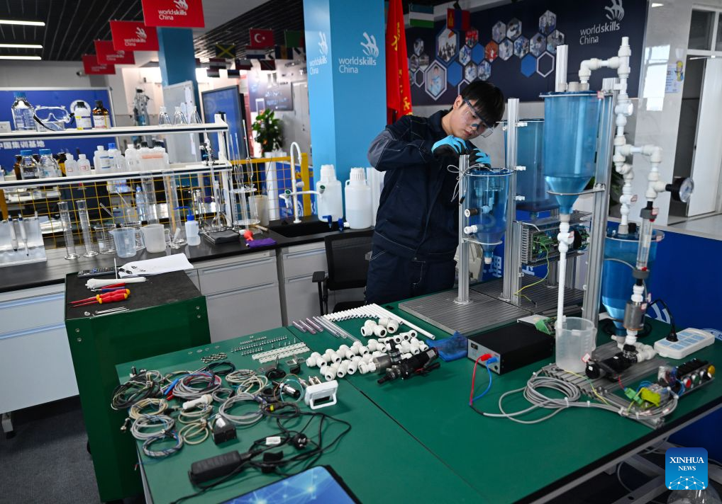 Lu Yi adjusts a device during a simulated competition training at a training base of Henan Chemical Technician College in Kaifeng City, central China's Henan Province, Sept. 1, 2026. At a training base of Henan Chemical Technician College, 23-year-old Lu Yi is preparing for the water technology event of the upcoming 48th WorldSkills Competition.

Lu enrolled at Henan Chemical Technician College in 2019 and began training for the water technology event three years later. The water technology event focuses on evaluating competitors' abilities in wastewater treatment process operations, water quality analysis, mechanical equipment maintenance, and electrical automation. In 2025, Lu won the gold medal in the water technology event at China's third Vocational Skills Competition.

During his daily training for the upcoming 48th WorldSkills Competition, Lu spends almost all his time in the laboratory, working with his coach to improve speed and adjust every detail of his movements. (Xinhua/Hao Yuan)