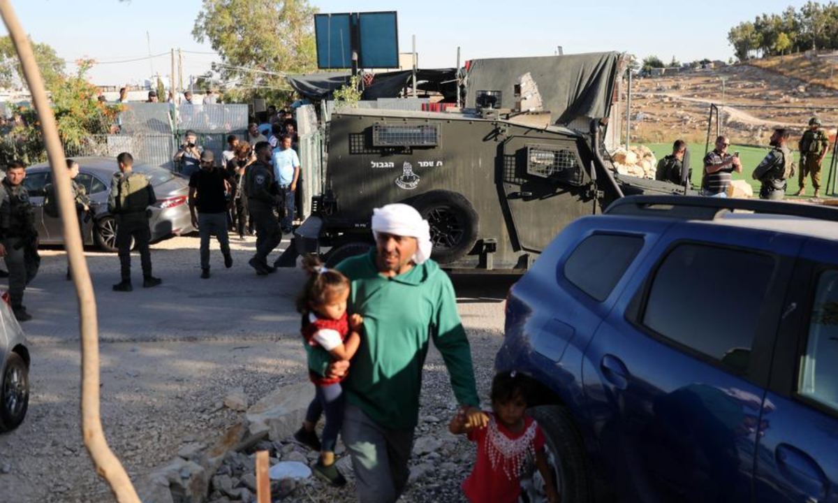 Israeli forces raid the village of Umm al-Kheir in the Masafer Yatta area, south of Hebron, the West Bank, during an event held to protest Israeli settler violence, July 28, 2026. (Photo by Mamoun Wazwaz/Xinhua)