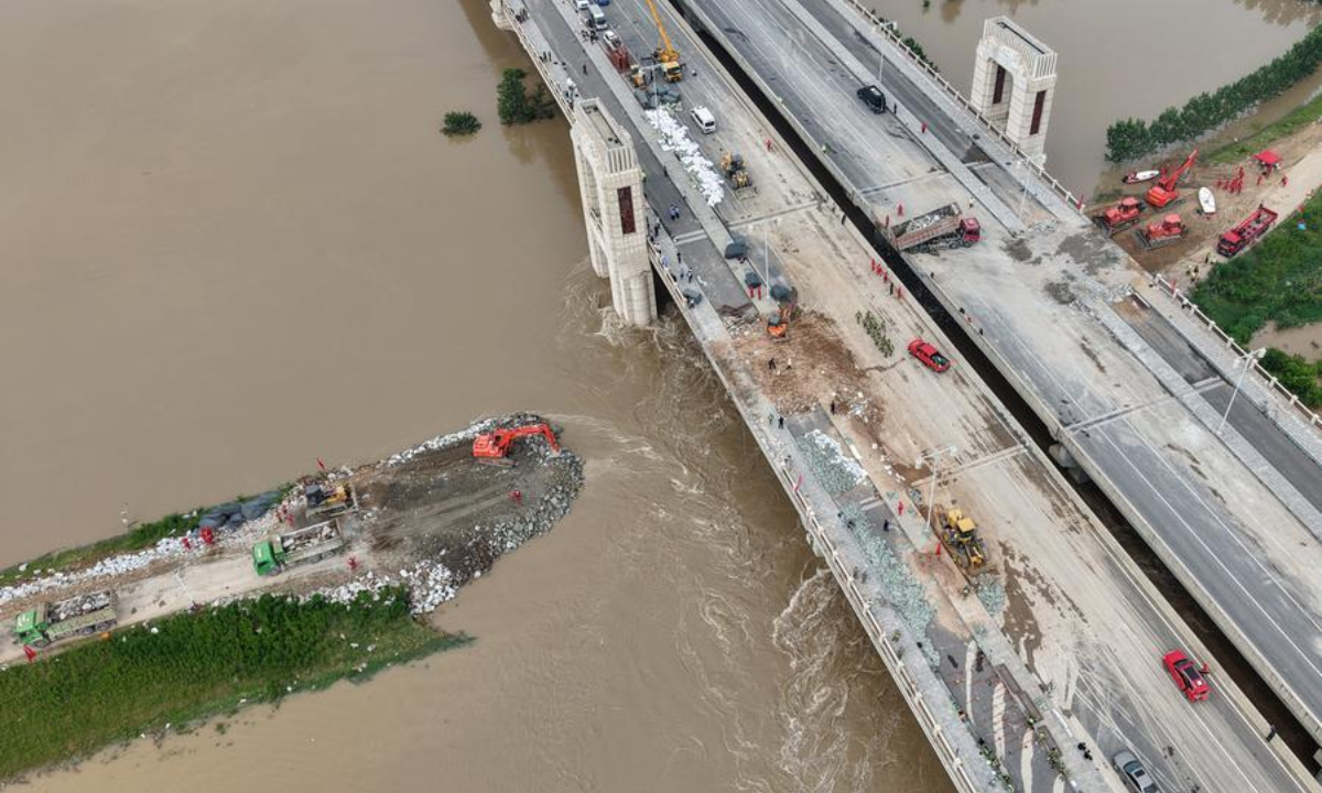 An aerial drone photo take on Aug. 15, 2026 shows repair work underway at the site of a levee breach along the Jialu River in Chuanhui District of Zhoukou City, central China's Henan Province. (Xinhua/Hao Yuan)