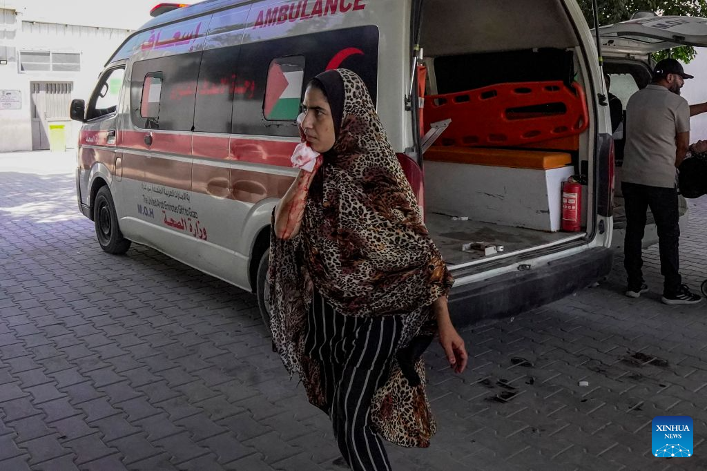 An injured woman is seen after being evacuated from the site of an Israeli airstrike, at Al-Shifa hospital, in Gaza City, on Aug. 19, 2026. At least nine Palestinians, including a woman, were killed Wednesday in an Israeli airstrike targeting a Hamas-run municipal police headquarters in central Gaza City, according to Palestinian sources.
Sources and witnesses said the airstrike caused a large explosion and scattered shrapnel around the headquarters, which is surrounded by tents housing displaced people. (Photo by Rizek Abdeljawad/Xinhua)