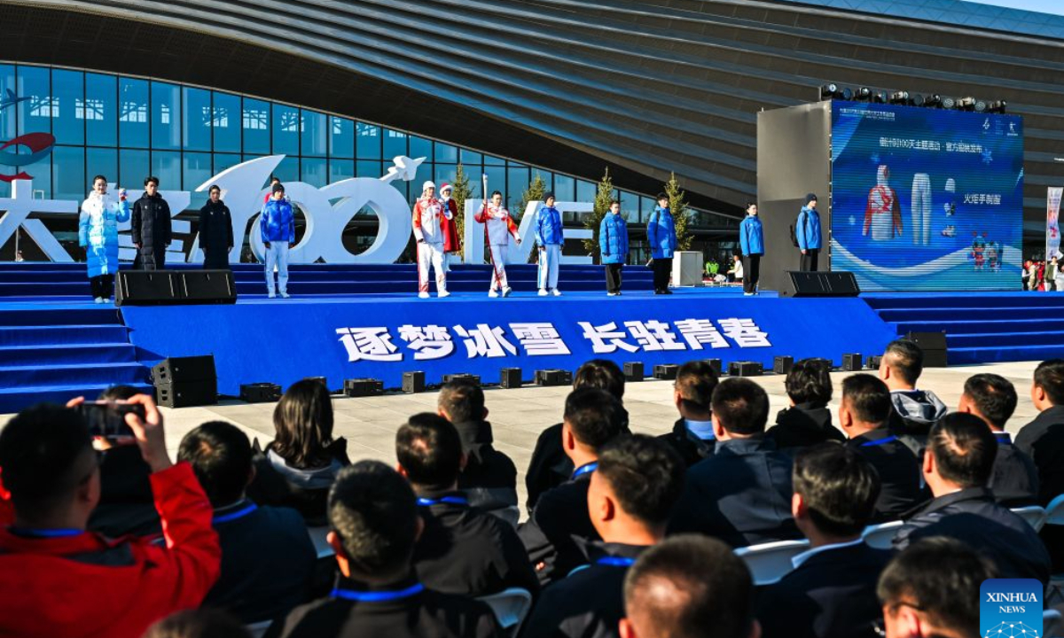 Staff members display uniforms and equipment at the 100-day countdown event for the Changchun 2027 Winter Universiade in Changchun, northeast China's Jilin Province, Oct. 7, 2026. The medals, torch, uniforms and equipment for the Changchun 2027 Winter Universiade were unveiled on Wednesday at a 100-day countdown event held at the Changchun International Aviation Expo City. (Xinhua/Xu Chang)