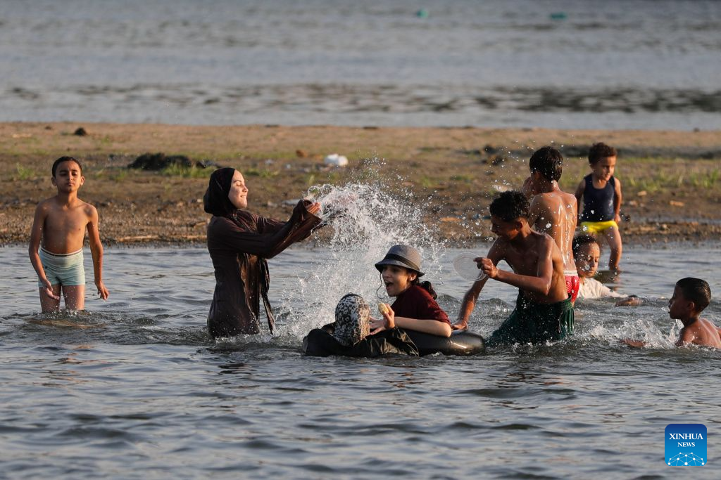 People cool themselves in the Nile River during a heatwave in Cairo, Egypt, Aug. 3, 2026. (Xinhua/Ahmed Gomaa)