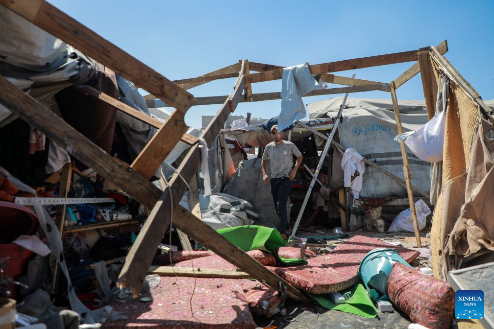 Palestinians inspect a damaged tent after it was targeted by a missile fired from an Israeli drone in the al-Rimal neighborhood in central Gaza, on Sept. 14, 2026. (Photo by Rizek Abdeljawad/Xinhua)