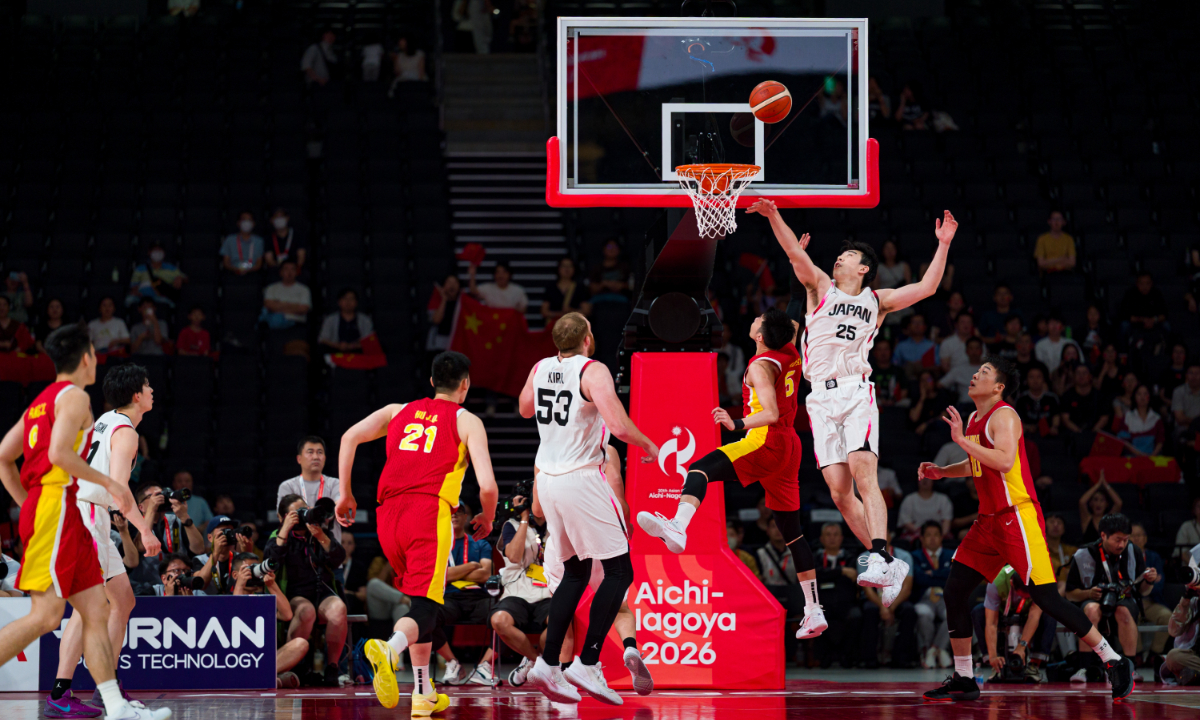 Yuto Kawashima (No.25) of Team Japan attempts to block the ball in the men's basketball semifinal match against Team China at the 20th Asian Games on September 18, 2026 in Nagoya, Japan.