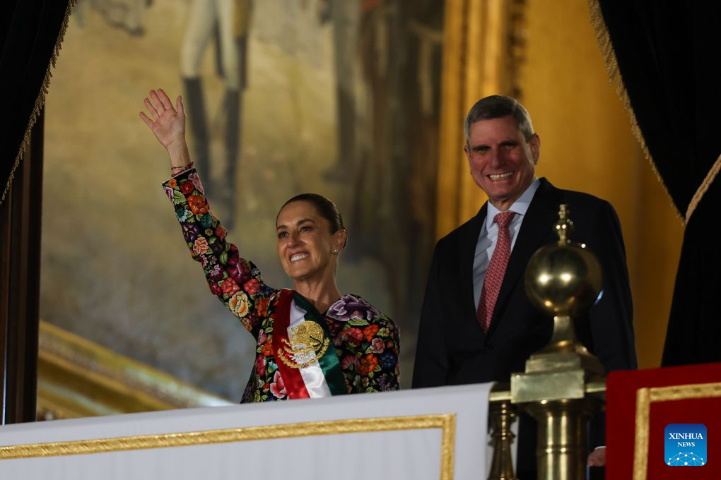 Mexican President Claudia Sheinbaum (L) and her husband attend celebrations for the upcoming Independence Day in Mexico City, Mexico, Sept. 15, 2026. Various celebrations were held in Mexico to welcome the country's annual Independence Day, which falls on Sept. 16. (Photo by Francisco Canedo/Xinhua)