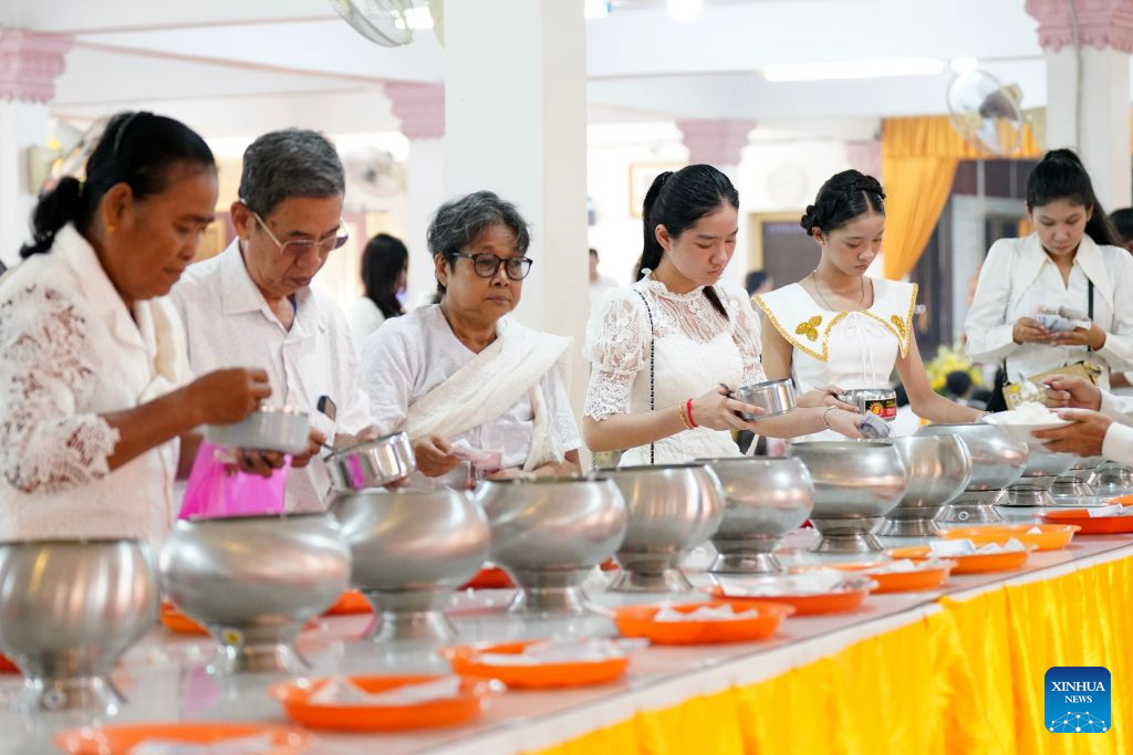 A woman prepares offerings during the Pchum Ben festival in Phnom Penh, Cambodia, Oct. 10, 2026. Cambodia on Saturday started to observe its traditional three-day Pchum Ben holiday, also known as Ancestor's Day, running from Oct. 10 to 12. (Photo by Sovannara/Xinhua)