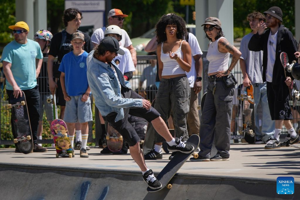 A skateboarder performs a trick during a Go Skateboarding Day event in Vancouver, British Columbia, Canada, on June 21, 2026. (Photo by Liang Sen/Xinhua)