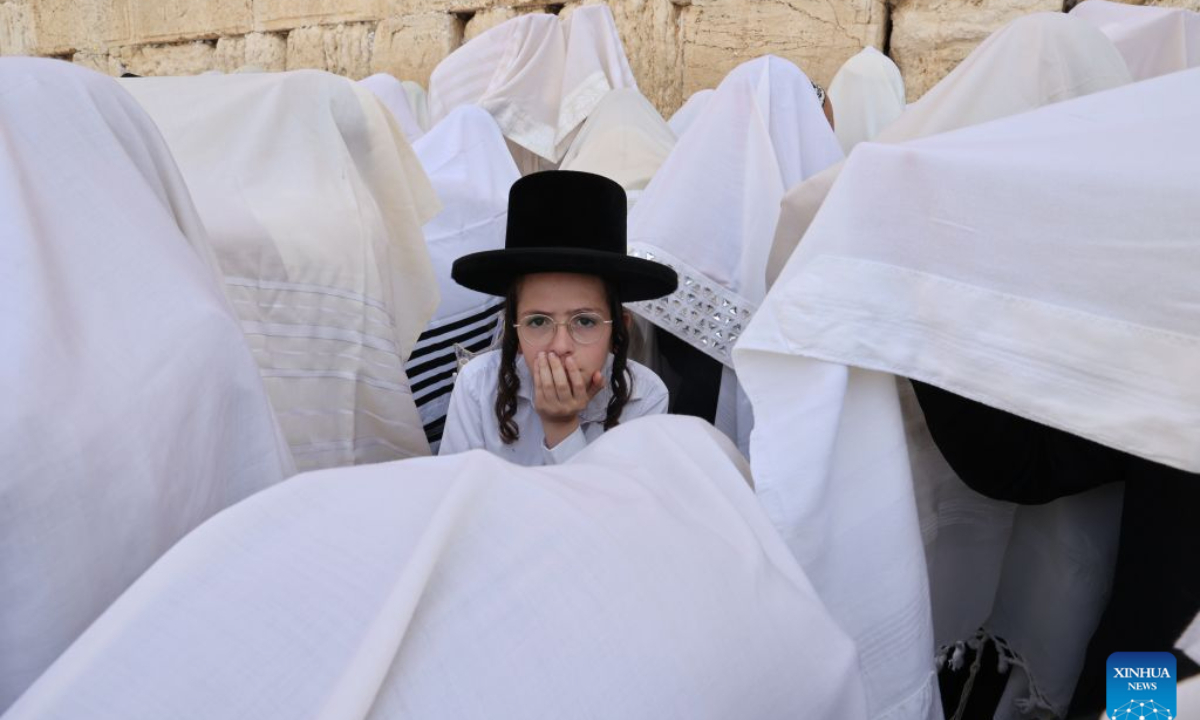 Jewish worshippers gather for prayer during the Sukkot holiday at the Western Wall in the Old City of Jerusalem on Sept. 28, 2026. (Photo by Gil Cohen Magen/Xinhua)