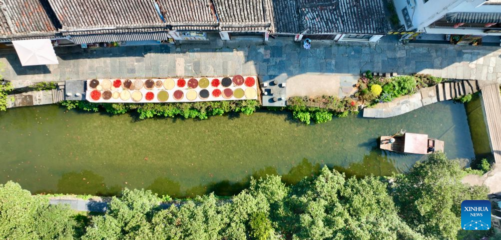 An aerial drone photo taken on Sept. 15, 2026 shows a view of Likeng Village of Wuyuan County, east China's Jiangxi Province. In autumn, villagers are busy drying agricultural products in Wuyuan County, and the colorful scene attracts tourists. (Xinhua/Hu Chenhuan)