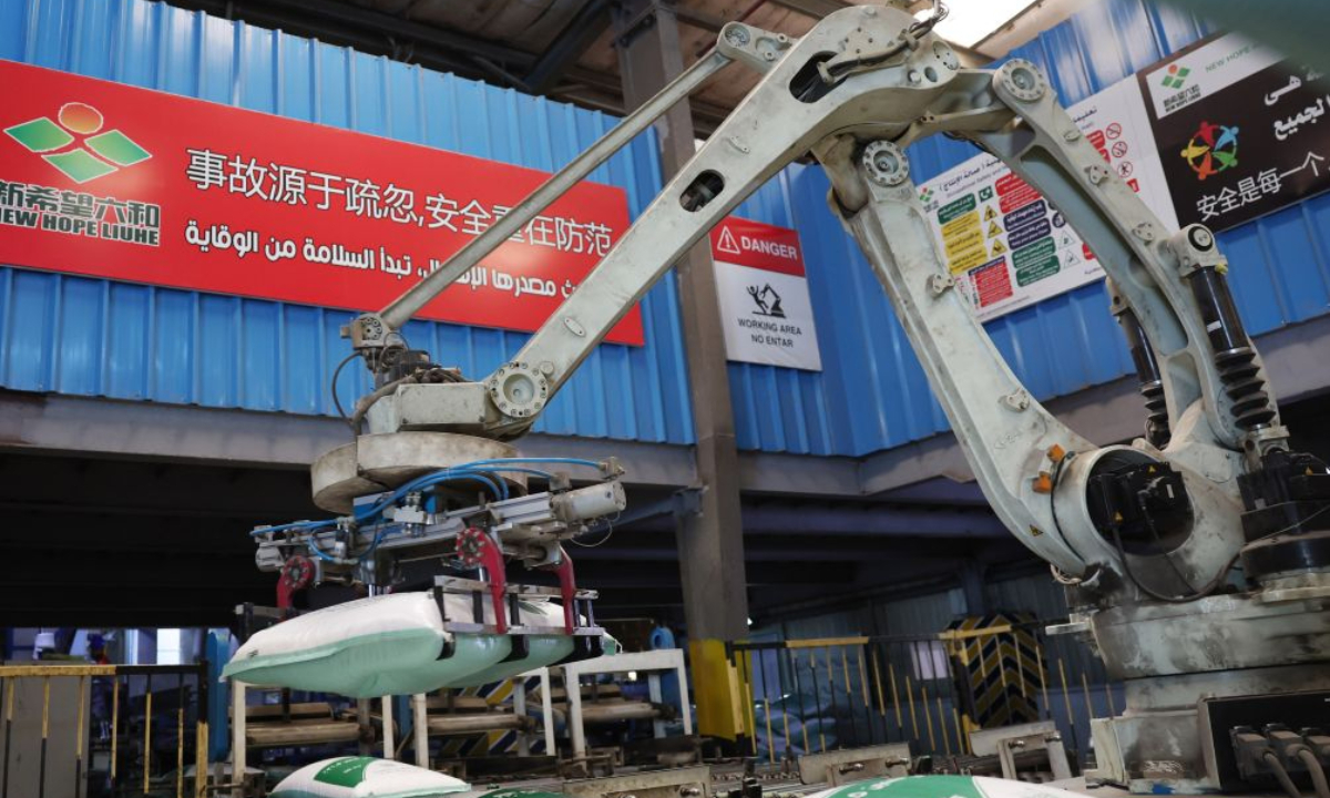 A robotic arm stacks bags of feed at New Hope Alexandria Co., Ltd. in Beheira Governorate, Egypt, July 27, 2026. (Xinhua/Zhang Haobo)