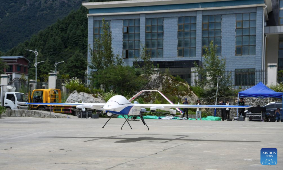 A high-altitude medium-sized composite-wing drone lands in Gyirong Town, southwest China's Xizang Autonomous Region, Aug. 31, 2026. The local emergency management department in Xizang Autonomous Region has dispatched a drone detection team to carry out disaster assessment missions. The medium-sized composite-wing drone has monitored the conditions of the barrier lake and the mountain terrain in the area affected by the mudslide, providing critical information to support search and rescue operations. (Xinhua/Jigme Dorje)