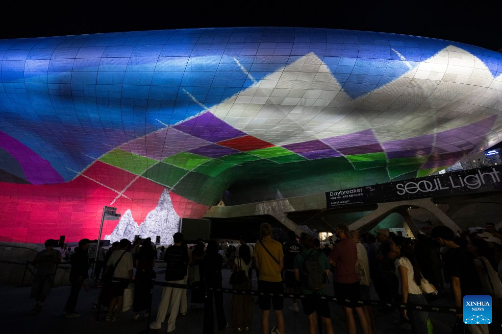 People watch a media art show during Seoul Light DDP 2026 Fall at Dongdaemun Design Plaza (DDP) in Seoul, South Korea, Sept. 8, 2026. The event runs from Sept. 3 to 13 under the theme K-Original Light. (Photo by Jun Hyosang/Xinhua)
