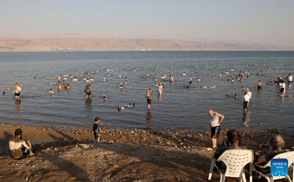 People float and relax in the waters of a Dead Sea resort, east of Jerusalem, Aug. 5, 2026. People visit the Dead Sea resort as high temperatures sweep across Israel and the Palestinian territories. (Photo by Gil Cohen Magen/Xinhua)