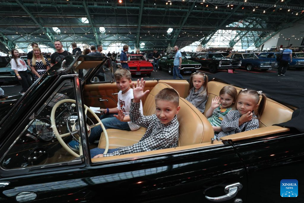 Children are pictured during a vintage car show in Minsk, Belarus, Aug. 29, 2026. (Photo by Henadz Zhinkov/Xinhua)