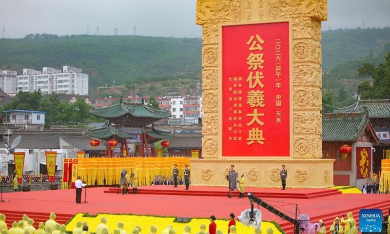 This photo taken on June 21, 2026 shows a ceremony worshiping Fuxi, a mythical ancestor of the Chinese nation, in Tianshui, northwest China's Gansu Province. Tianshui is known as the birthplace of the mythical figure, who is worshiped for his contribution to teaching people about fishing, hunting and animal husbandry. According to historical records, the annual commemoration of Fuxi has a history of more than 2,000 years. It was listed as a form of national intangible cultural heritage in 2006. (Photo by Liu Keying/Xinhua)