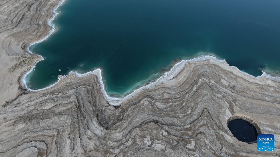 An aerial drone photo taken on Aug. 24, 2026 shows a view of the Dead Sea and sinkholes near Ein Gedi beach of Israel. (Photo by Gil Cohen Magen/Xinhua)