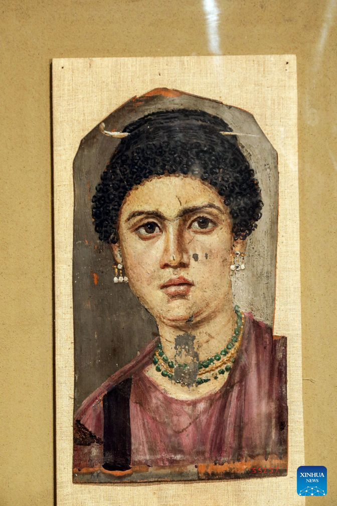 Photo taken on Oct. 11, 2026 shows a Fayum portrait which will be displayed at Rome's Ara Pacis Museum, at a press conference in Cairo, Egypt. Egypt has restored the Tondo of the Two Brothers, an ancient Egyptian portrait from the Roman period that will be displayed outside the country for the first time, Egyptian Minister of Tourism and Antiquities Sherif Fathy announced Sunday. Fathy made the announcement at a press conference at the Egyptian Museum in Tahrir, Cairo, where the restored masterpiece was unveiled. It will be displayed at Rome's Ara Pacis Museum as part of the exhibition The Power of the Portrait: Egypt and Rome, Faces of Fayum, running from Nov. 5, 2026, to May 2, 2027. (Xinhua/Ahmed Gomaa)
