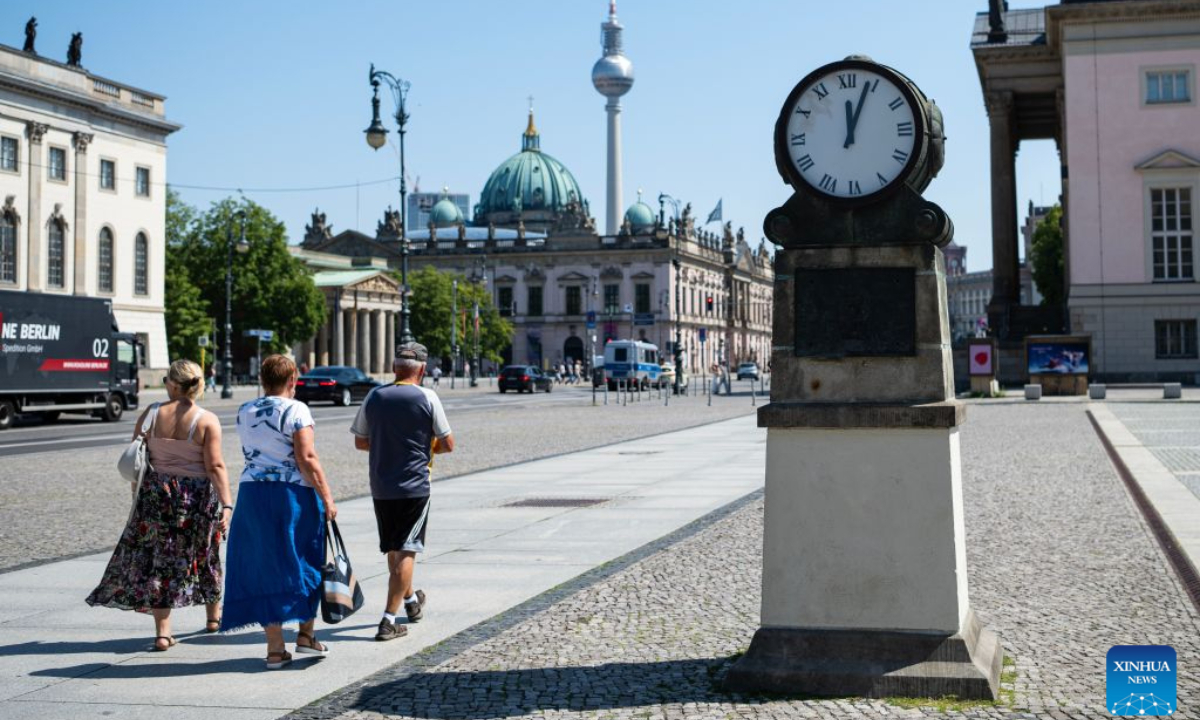 People walk under the midday sun in Berlin, capital of Germany, July 30, 2026. Germany recorded an estimated 9,800 heat-related deaths as of July 19, surpassing the annual total for every year since 2016, the Robert Koch Institute (RKI), the country's leading public health authority, said Thursday. (Xinhua/Zhang Haofu)