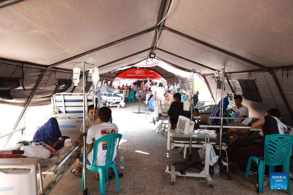Patients and their relatives rest at an emergency tent outside Komodo Regional Hospital, East Nusa Tenggara Province, Indonesia, Aug. 17, 2026. The death toll from a 7.7-magnitude earthquake that struck Indonesia's East Nusa Tenggara (NTT) province has risen to 68, the National Disaster Management Agency (BNPB) said Monday. (Indonesia's Ministry of Health/Handout via Xinhua)