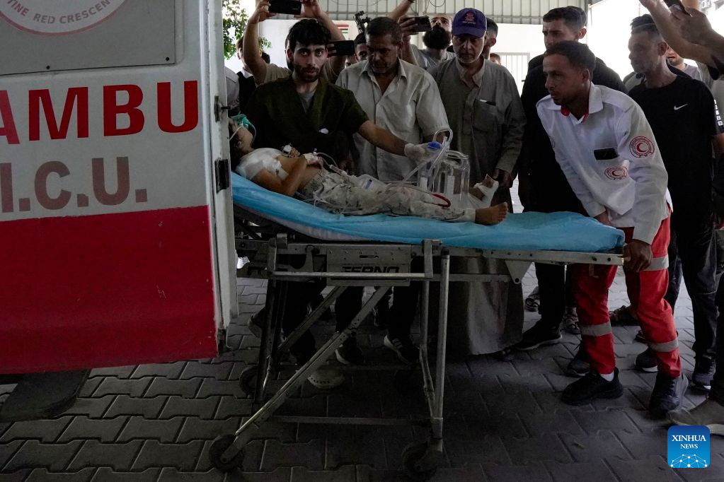 An injured child is seen after being evacuated from the site of an Israeli airstrike, at Al-Shifa hospital, in Gaza City, on Aug. 19, 2026. At least nine Palestinians, including a woman, were killed Wednesday in an Israeli airstrike targeting a Hamas-run municipal police headquarters in central Gaza City, according to Palestinian sources.
Sources and witnesses said the airstrike caused a large explosion and scattered shrapnel around the headquarters, which is surrounded by tents housing displaced people. (Photo by Rizek Abdeljawad/Xinhua)